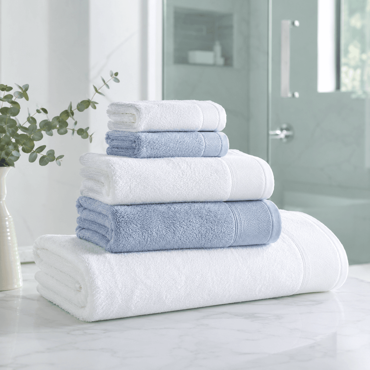 Towel Refresh Bundle arranged in a bright bathroom